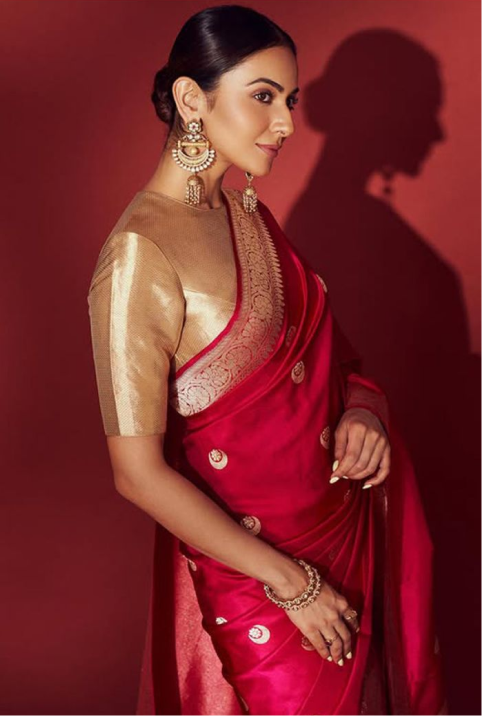 Elegant saree model showcasing a red saree