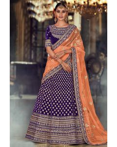 Purple color Velvet Lehenga Choli with Orange Net Dupatta