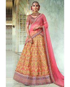 Yellow and Maroon Silk Dupion Lehenga Choli with Pink Net Dupatta