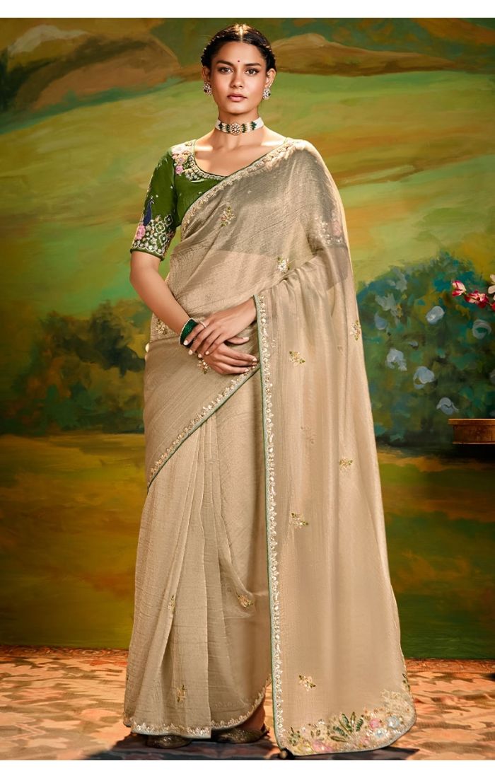 Beige organza saree front view with mehendi green raw silk blouse