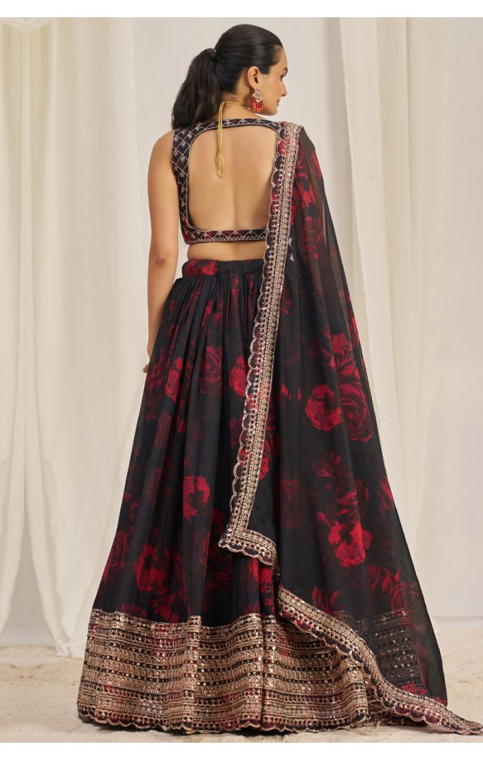 Detailed view of round neck embroidered black blouse with golden threadwork and floral design – ethnic Navaratri lehenga choli set
