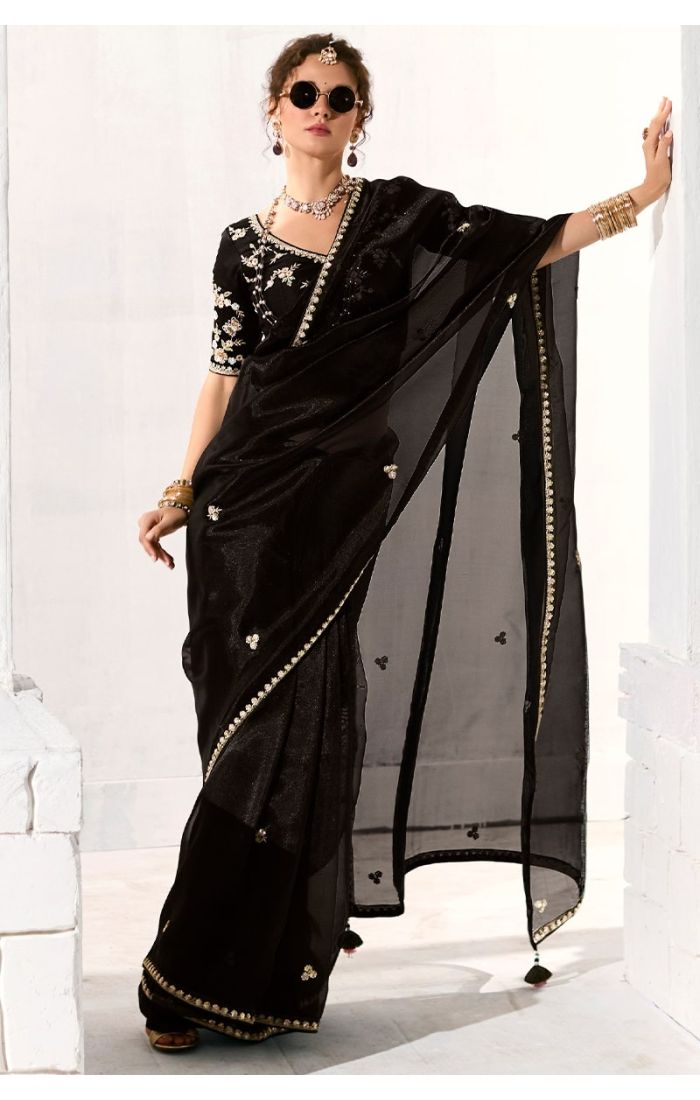 Side view showcasing sheer pallu and embroidery details