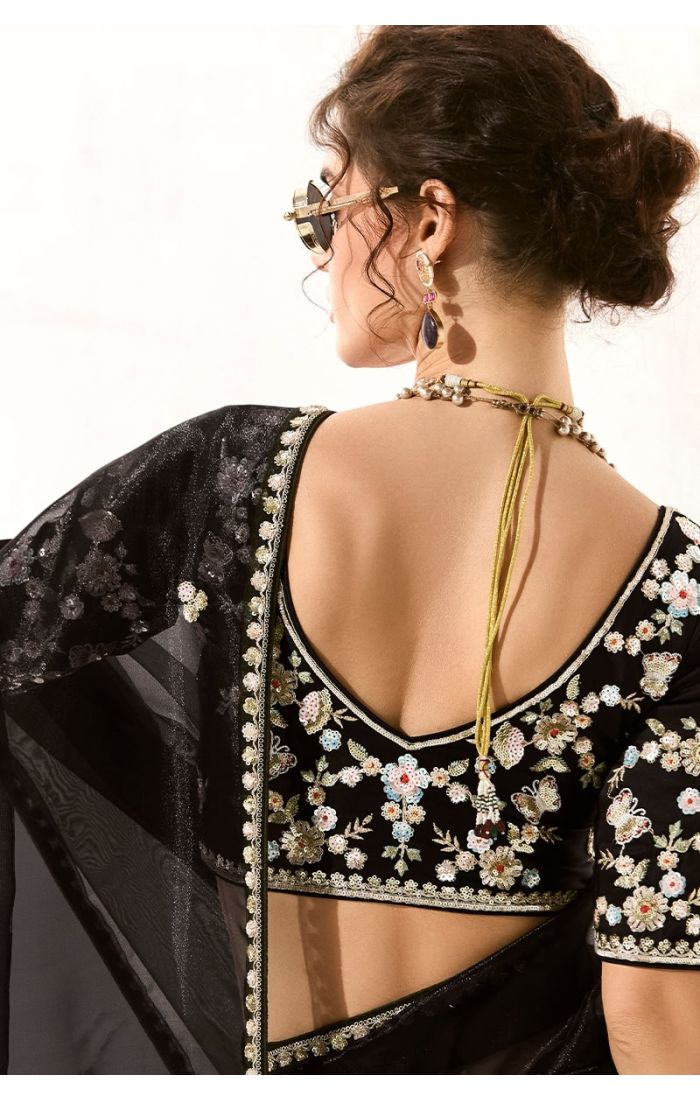 Backside close-up of multicolour embroidered silk blouse