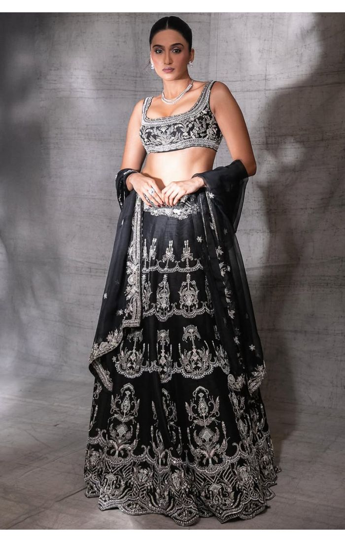 Model wearing black raw silk lehenga choli with silver embroidery – LEHV4062
