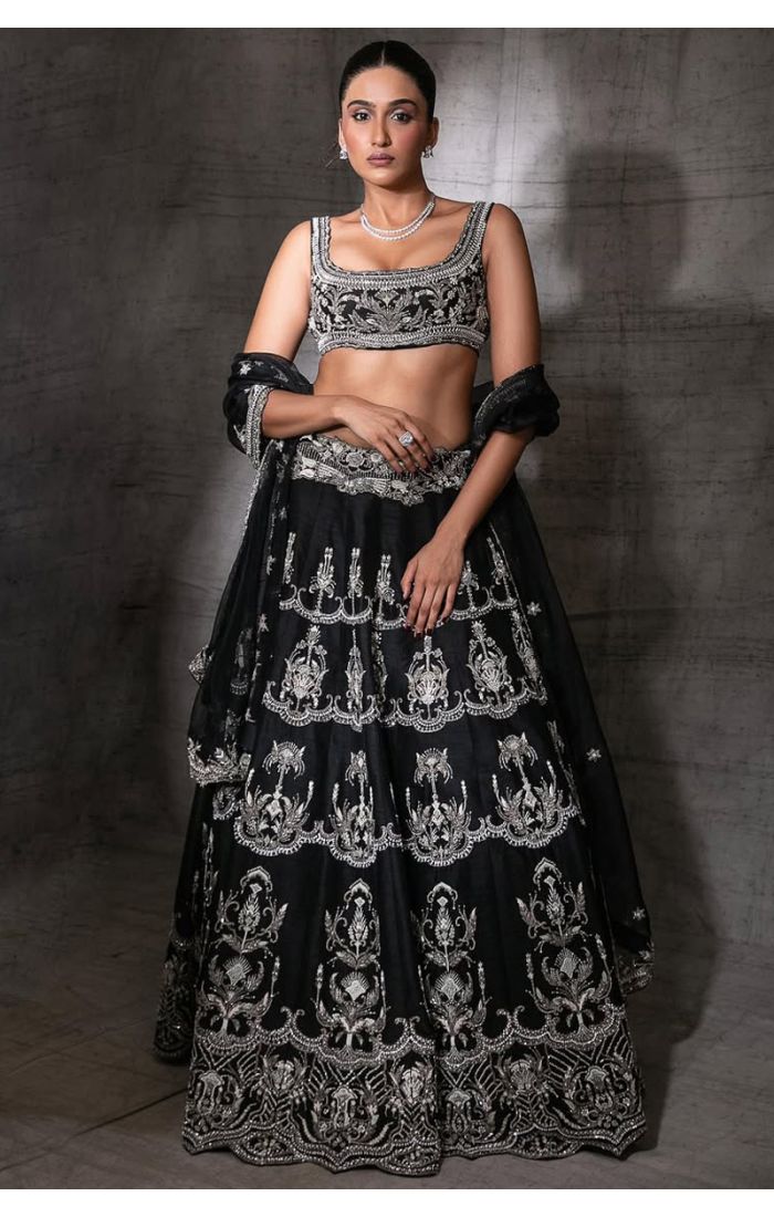 Model wearing black raw silk lehenga choli with silver embroidery – LEHV4062
