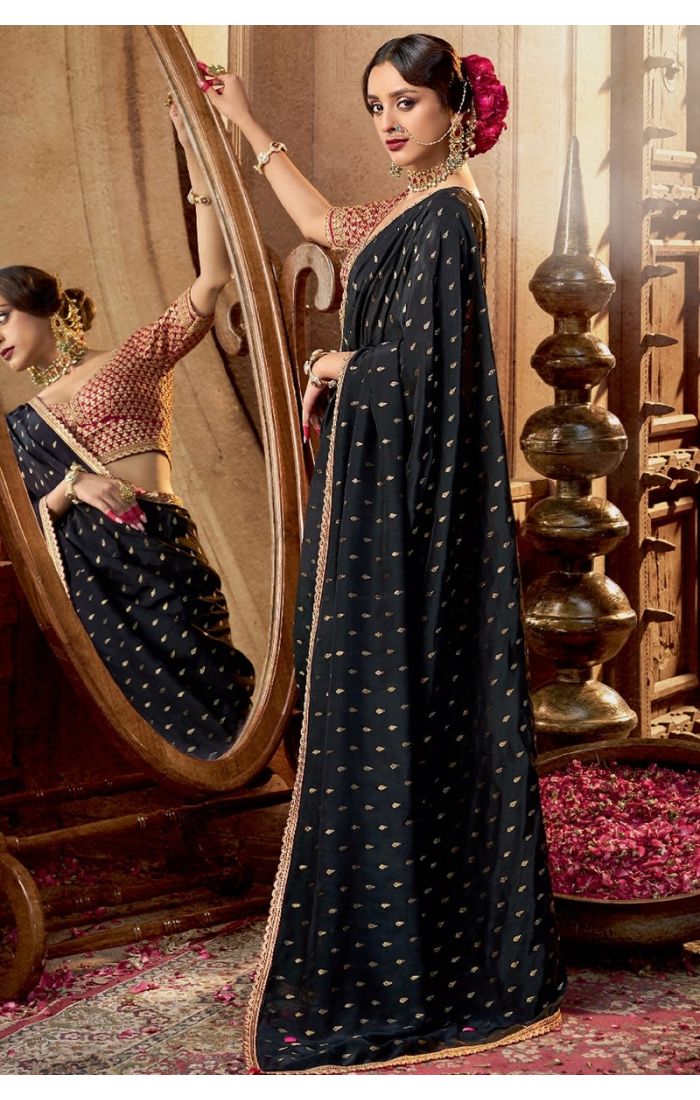 Model in elegant black saree styled for wedding or evening function