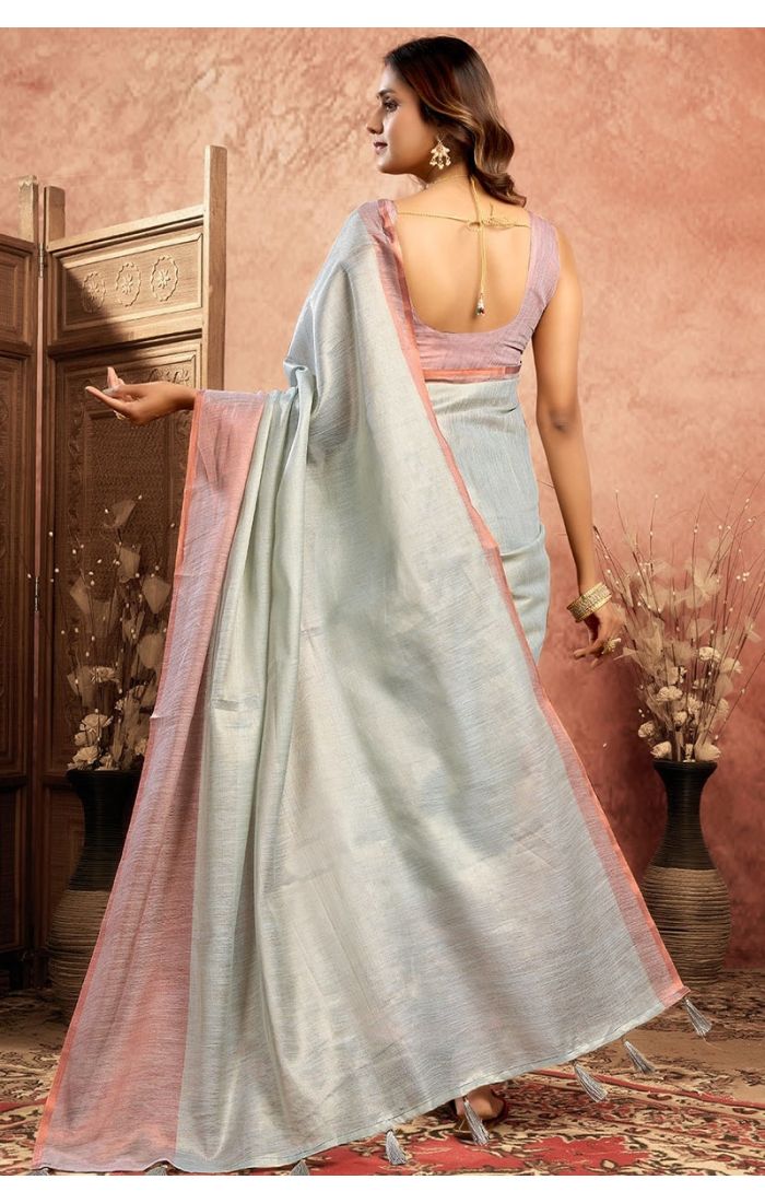 Back view of blue plain tissue saree worn by model