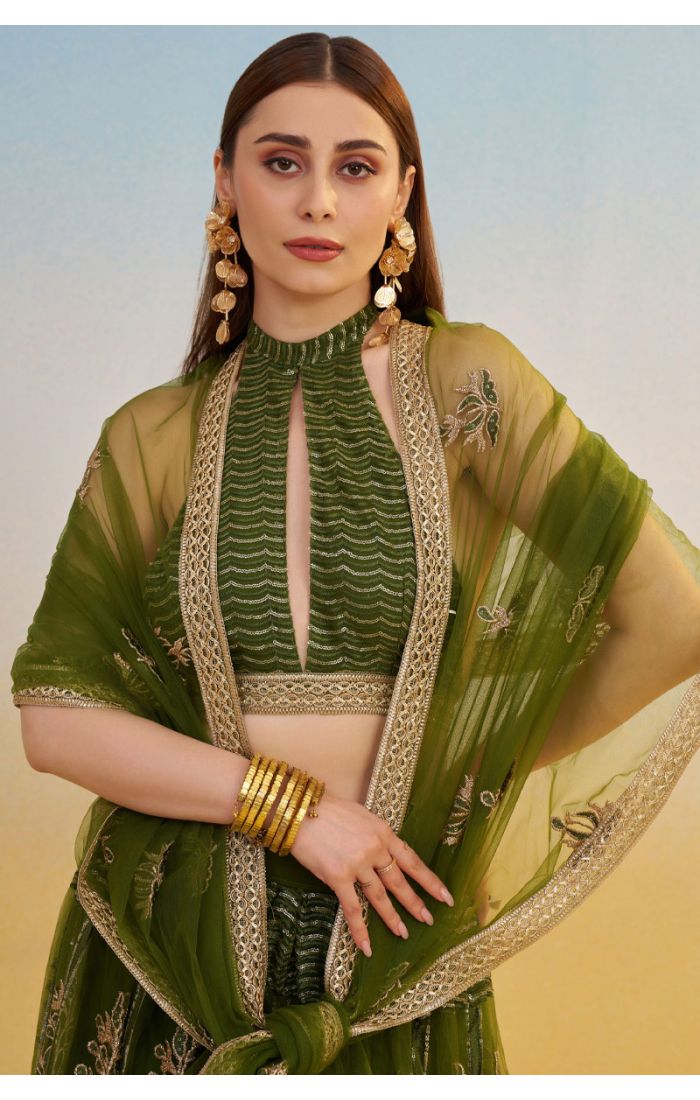 Close-up of bottle green halter neck blouse and embroidered dupatta, luxury designer ethnic couture by Appelle Fashion.