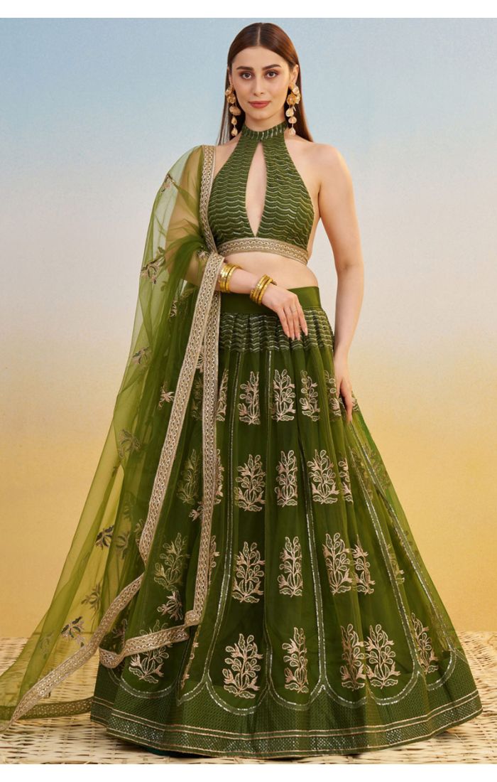Bottle green embroidered net lehenga with sequin and thread work, halter neck blouse — full front view, modern party or wedding wear, Appelle Fashion.