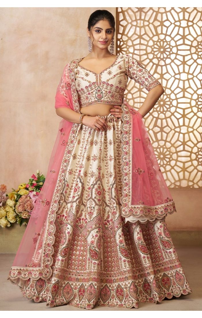 Cream and pink imperial bridal lehenga front view with embroidered net dupatta