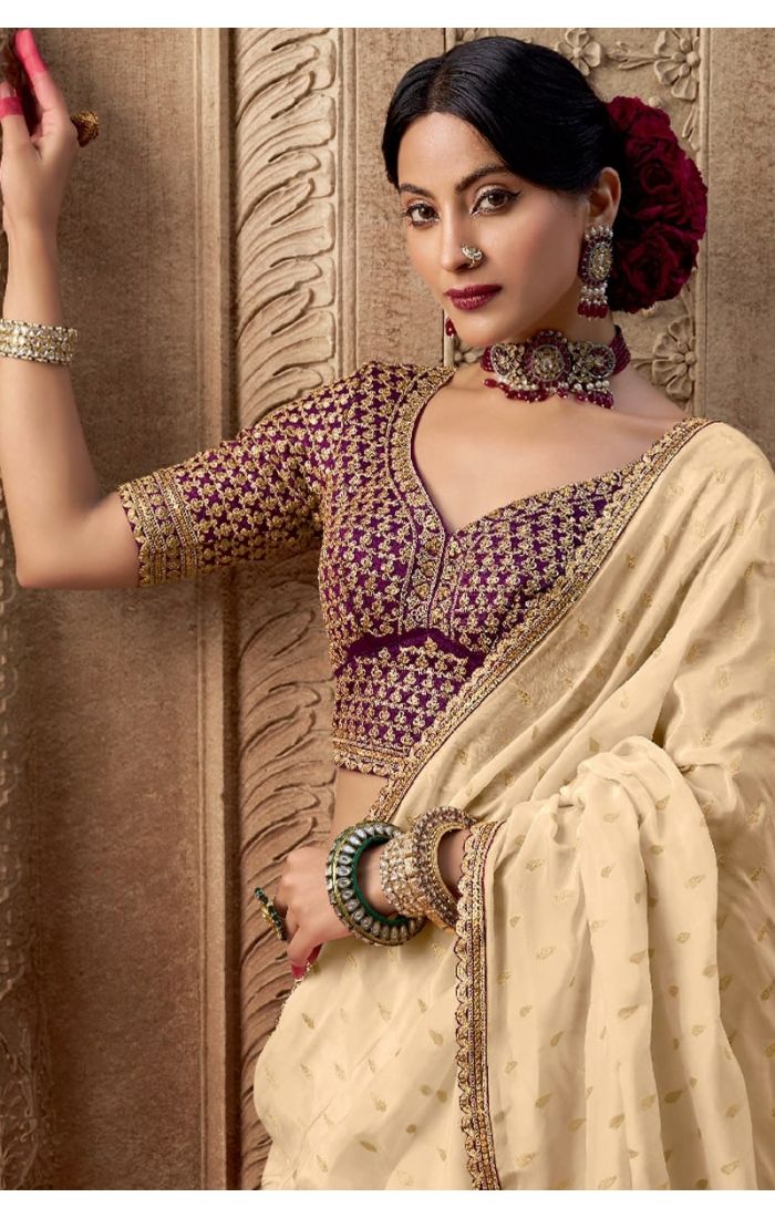 Close-up of zari-resham embroidery and hand-dyed weaving work on saree