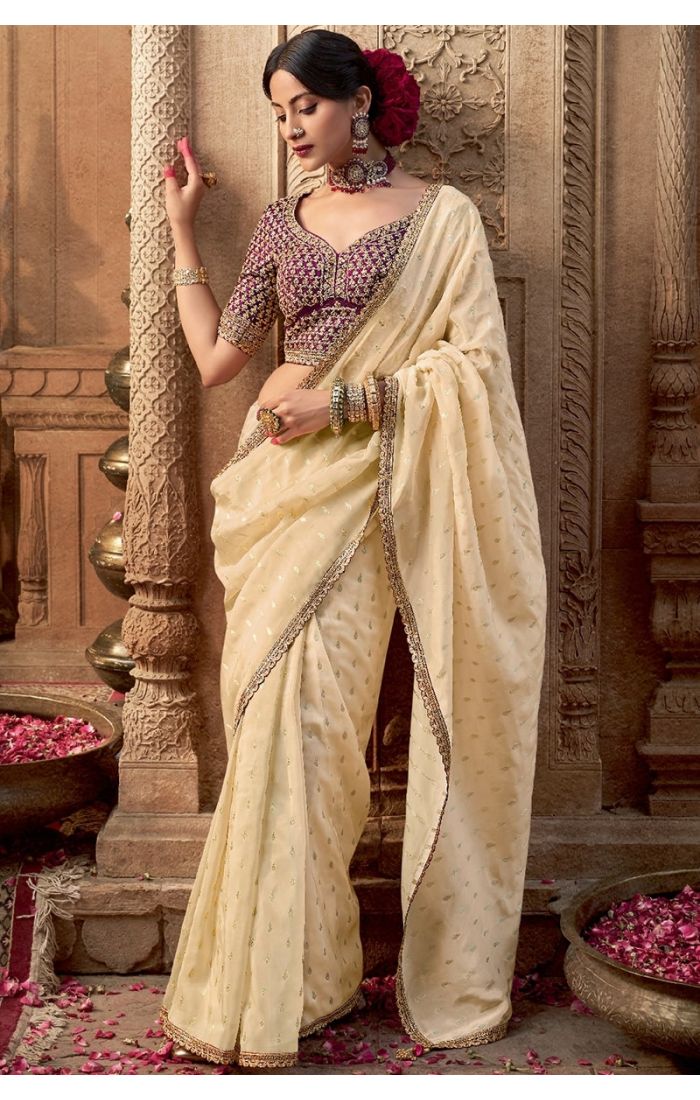 Full front view of cream viscose crepe saree with silk blouse and zari embroidery
