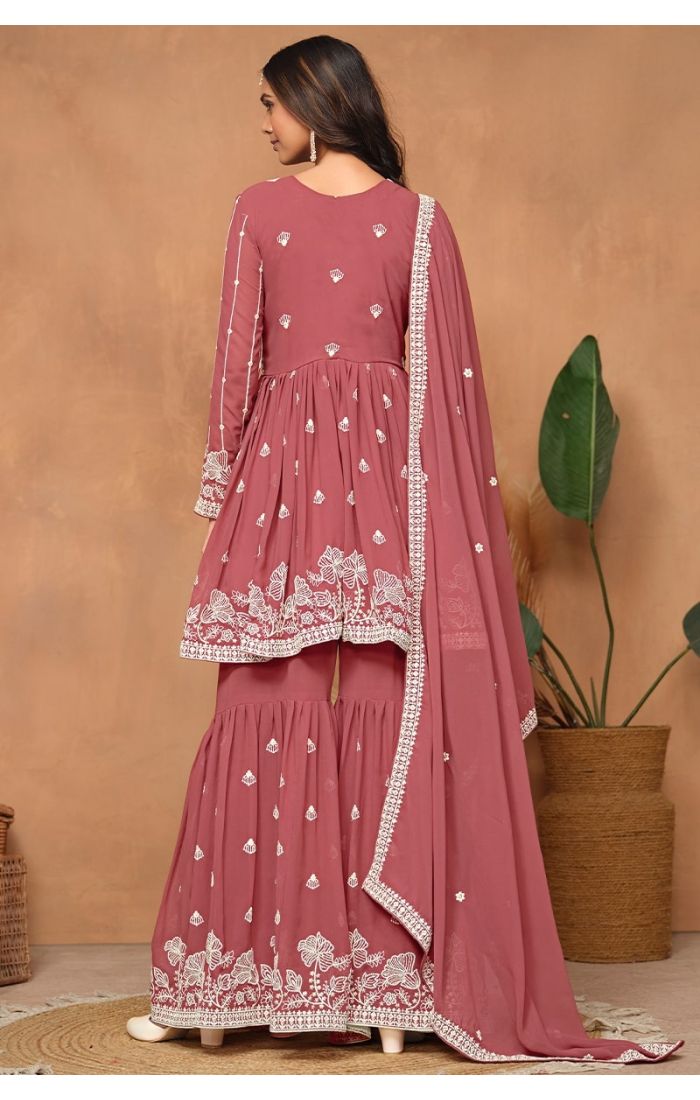 back angle showcasing flared sharara pants and embroidery.