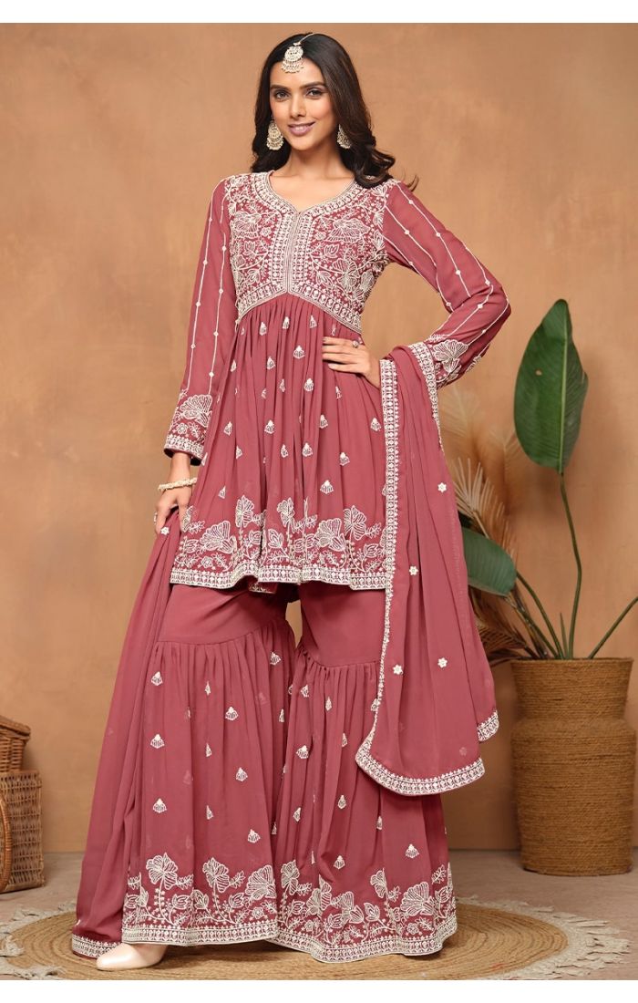  Front view of red georgette sharara suit with detailed embroidery and sequins.