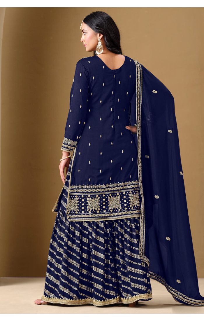 Back view showcasing flared sharara and dupatta border in SALV5733