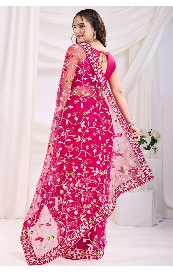 Back view of dark pink soft net saree showcasing delicate thread embroidery