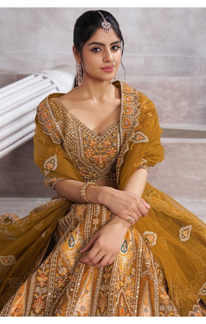 Close-up of embroidery on mustard lehenga choli with sequins and floral aari design – Appelle Fashion