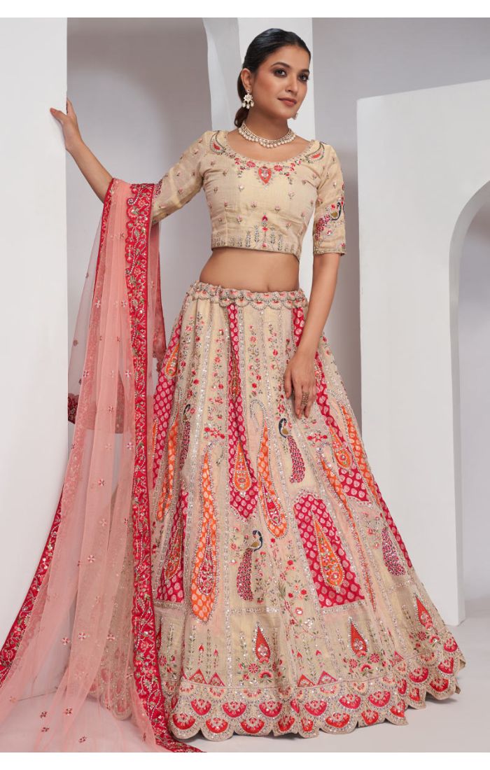 Elegant Beige Silk Lehenga with Intricate Embroidery and Vibrant Accents for Weddings and Festive Occasions