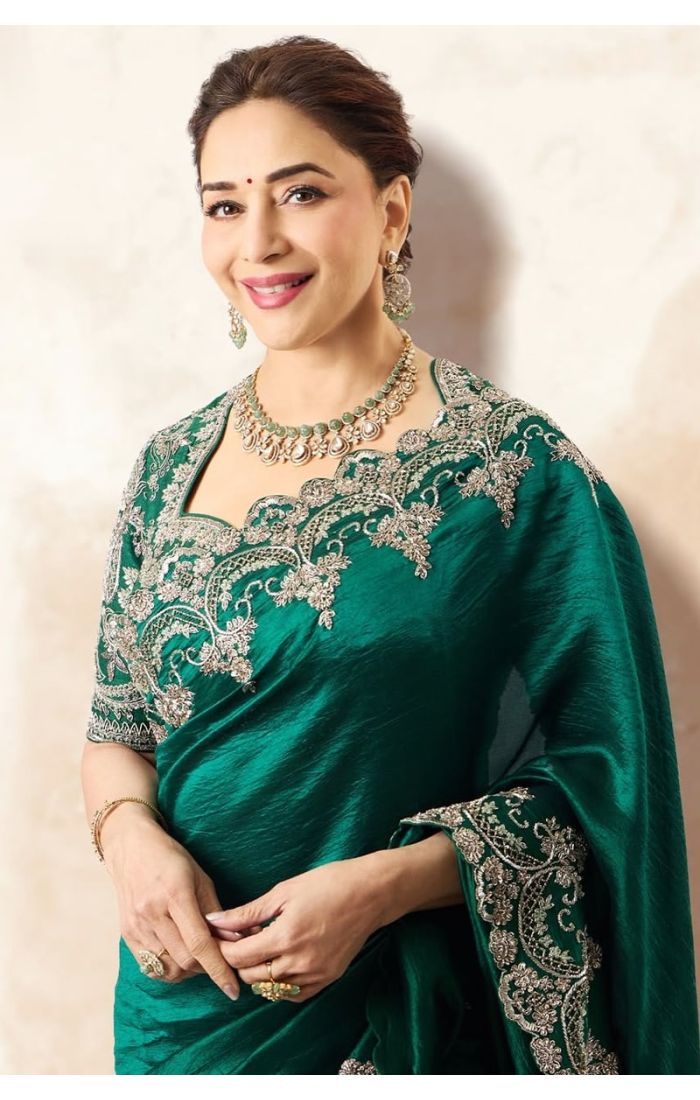 Close-up of blouse and neckline embroidery on emerald saree