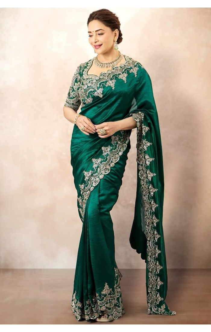 Side view highlighting the pleats and intricate detailing on the hem