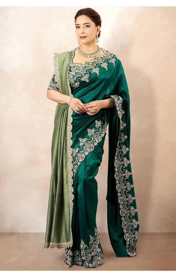 Full-length view of emerald green silk saree with intricate zari embroidery