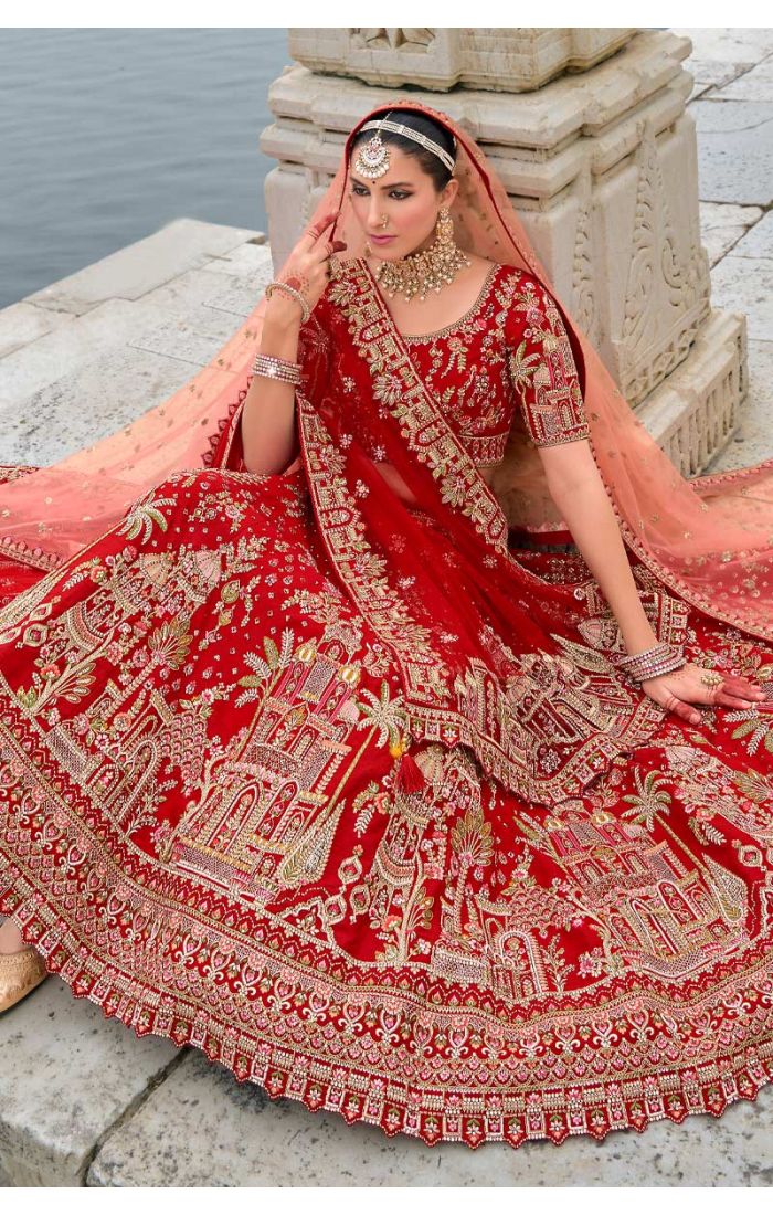 Exquisite red bridal lehenga with Zardosi embroidery and architectural design, ideal for weddings and special occasions. Australia, UK and USA