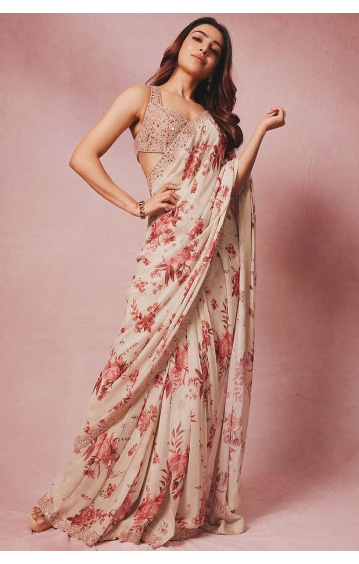  Full view of floral printed georgette saree worn with embellished blouse
