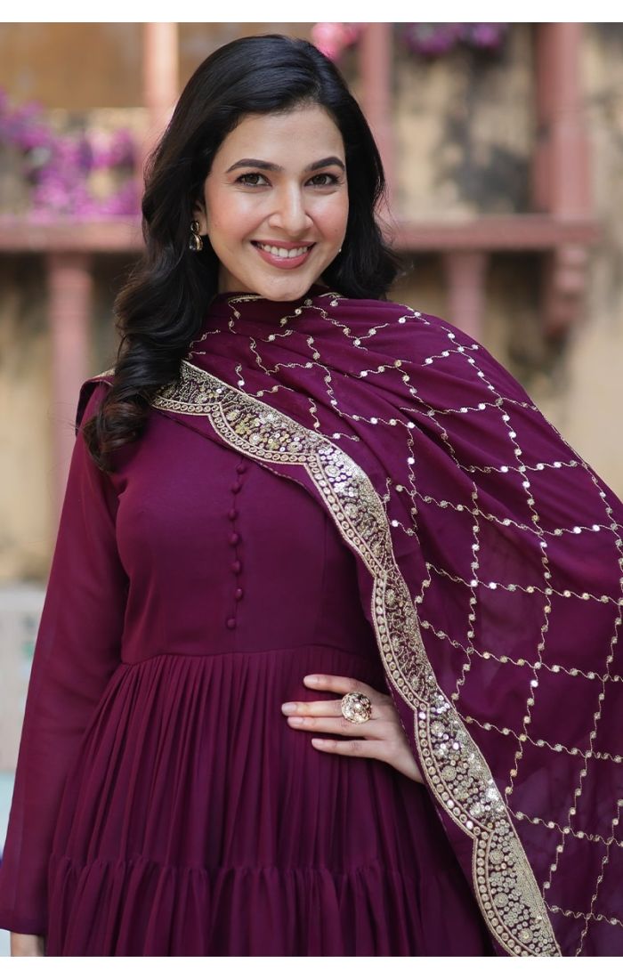Elegant woman in wine purple georgette long gown with sequins-embellished dupatta, ideal festive wedding ethnic wear for USA, Canada, UK, Europe