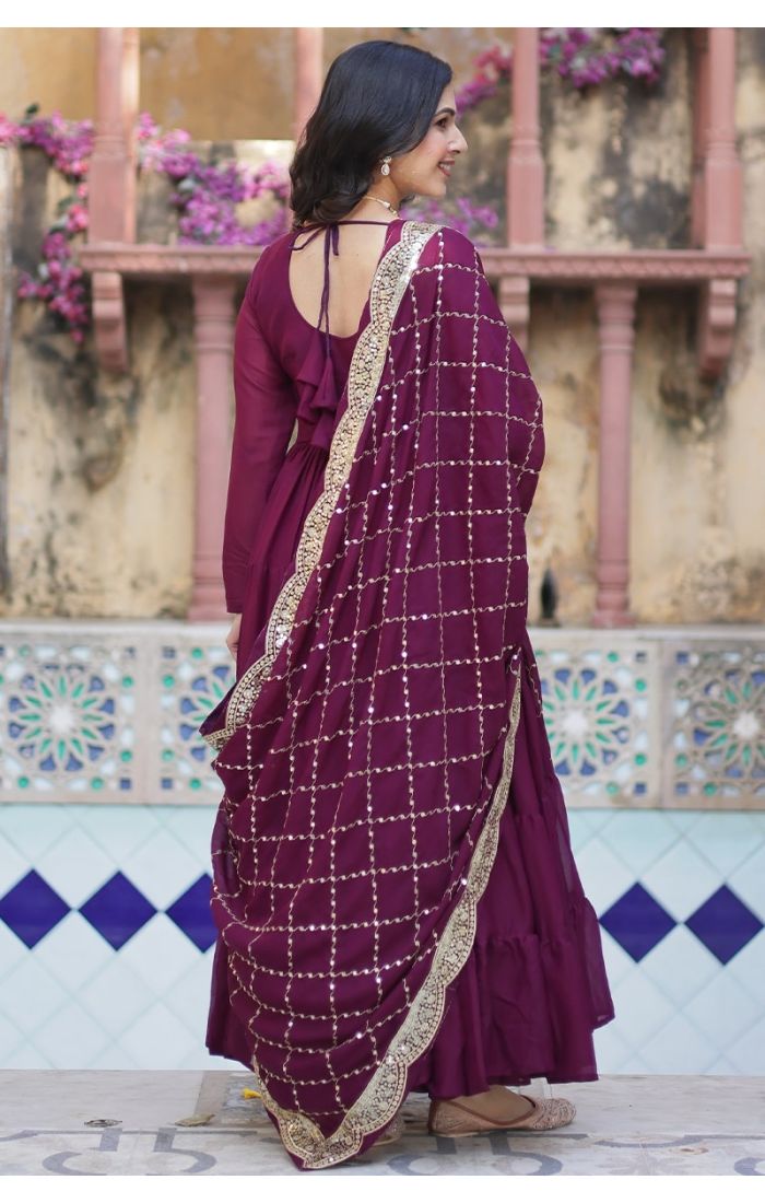 Elegant woman in wine purple georgette long gown with sequins-embellished dupatta, ideal festive wedding ethnic wear for USA, Canada, UK, Europe