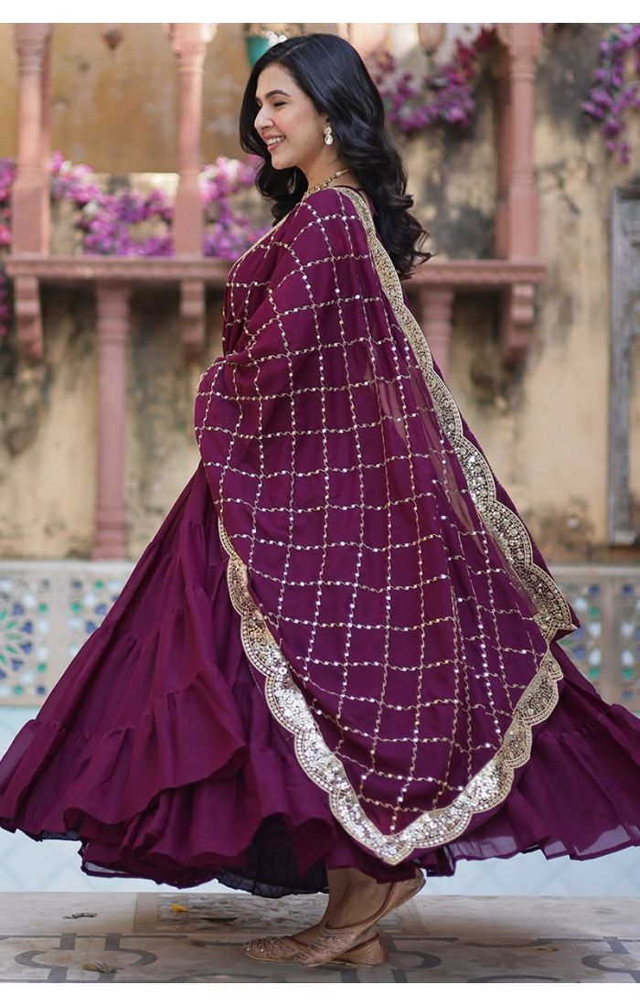 Elegant woman in wine purple georgette long gown with sequins-embellished dupatta, ideal festive wedding ethnic wear for USA, Canada, UK, Europe