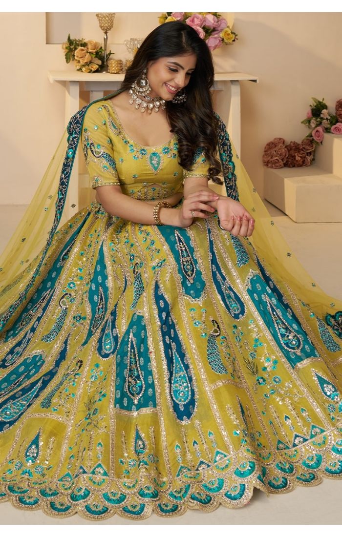 Seated bride in yellow lehenga with sequin work and dupatta – sangeet outfit USA