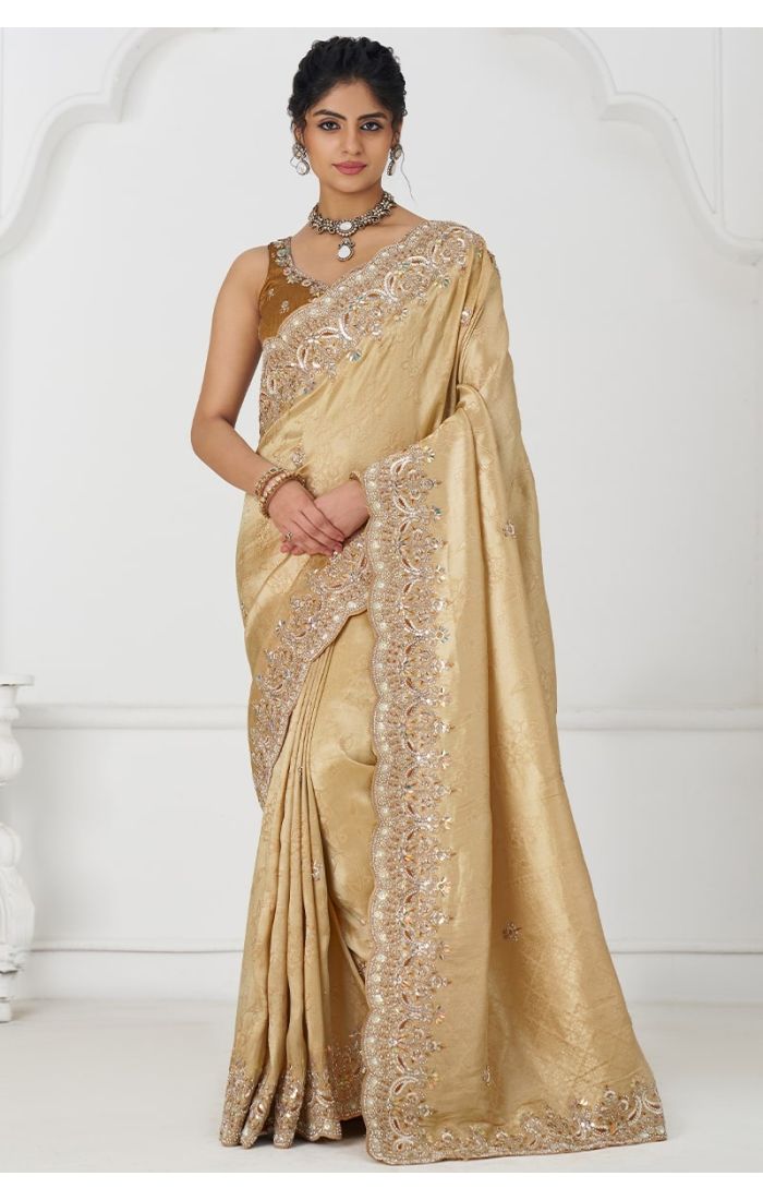 Model wearing Golden Pure Dola Viscose Silk Saree with Sequins and Beads Embroidery