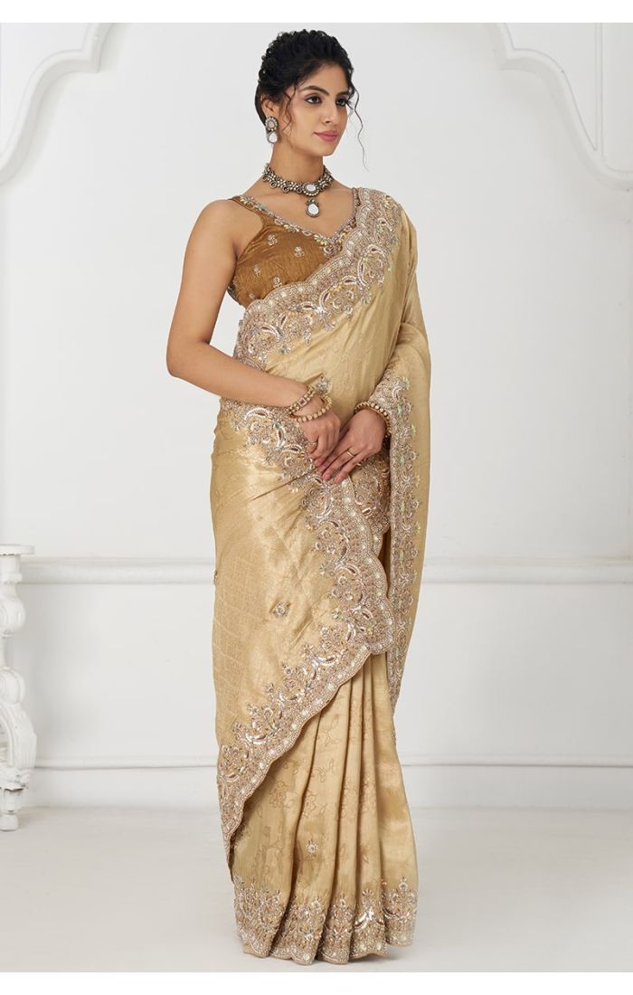 Elegant Side Pose in Golden Dola Viscose Silk Saree with Intricate Embroidery