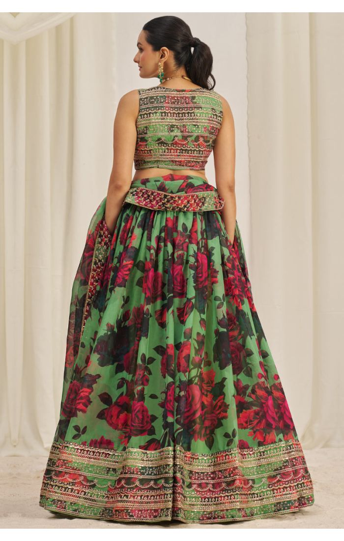 Back view of green floral lehenga with embroidered choli and detailed dupatta