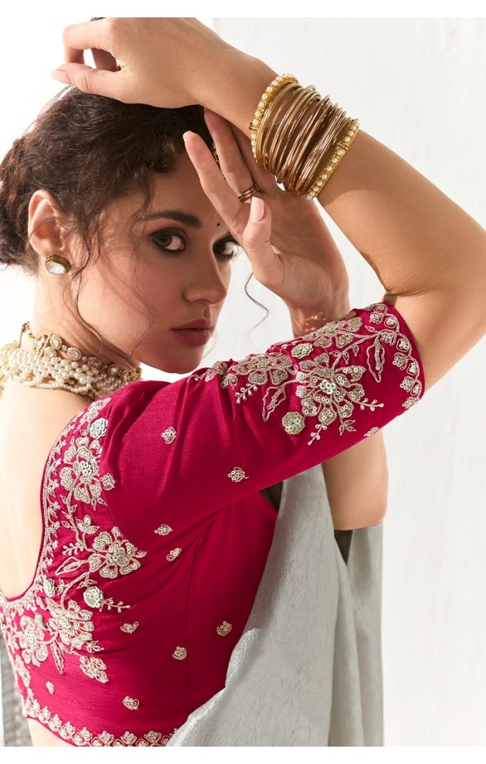Close-up of magenta blouse with floral resham and sequin embroidery
