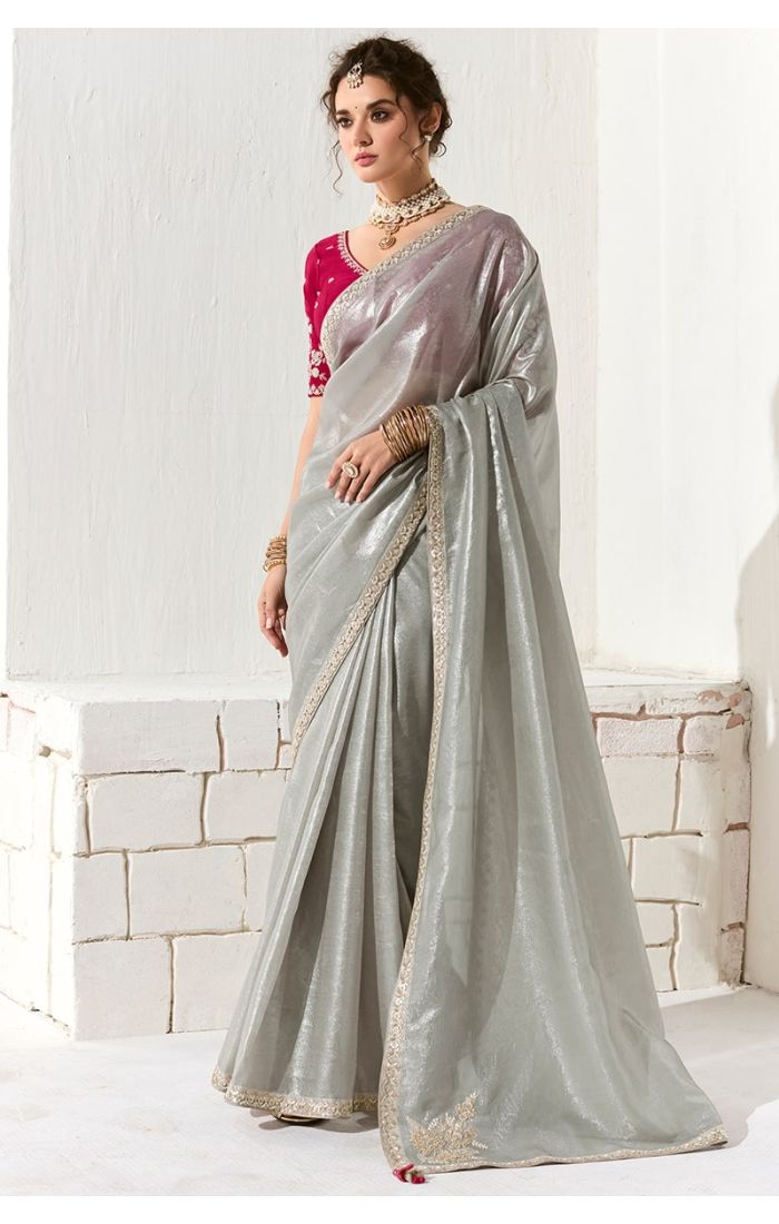 Model wearing grey organza silk saree with embroidered magenta blouse – front view