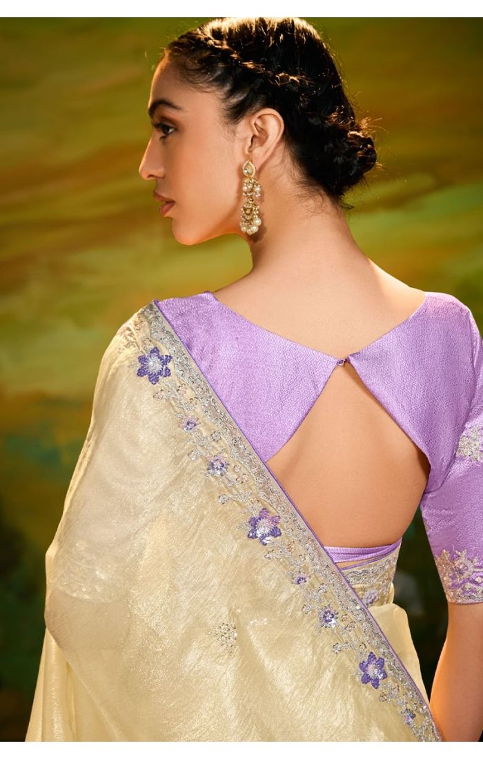 Back view highlighting pallu embroidery and lavender raw silk blouse
