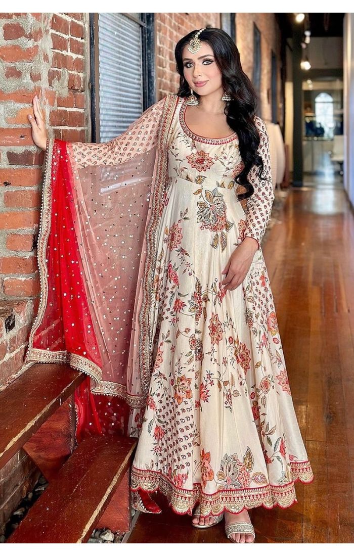 Elegant Ivory Bloom Georgette Plazo Suit with floral embroidery and a scalloped dupatta, ideal for weddings and festive occasions.