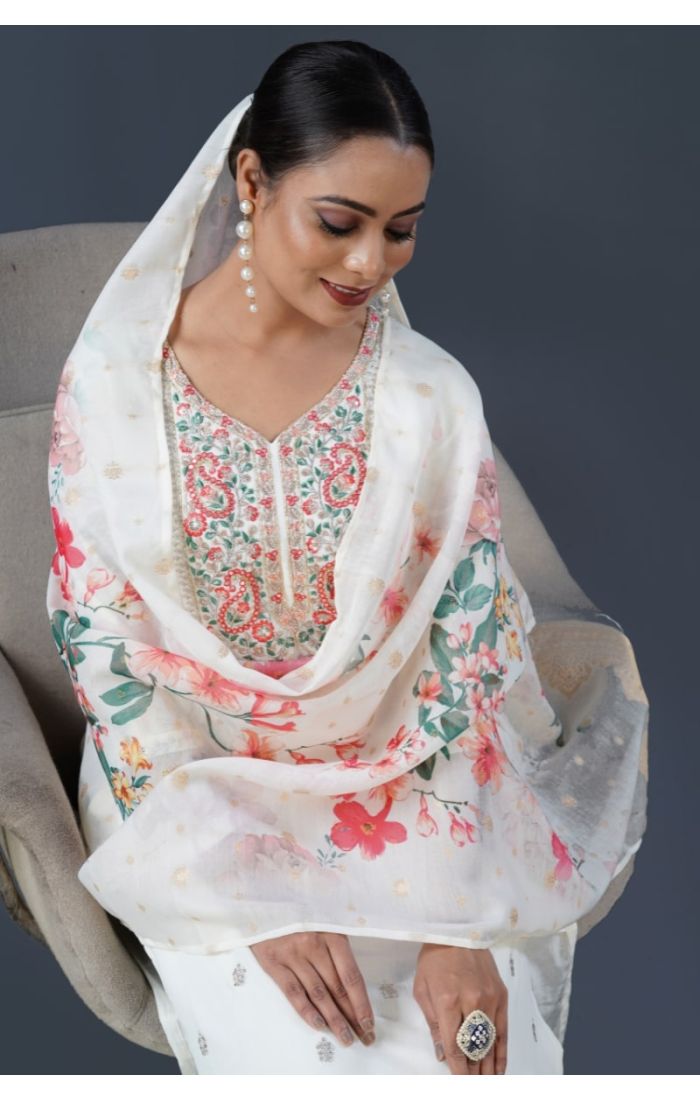 Model wearing ivory cotton kurta set with floral dupatta