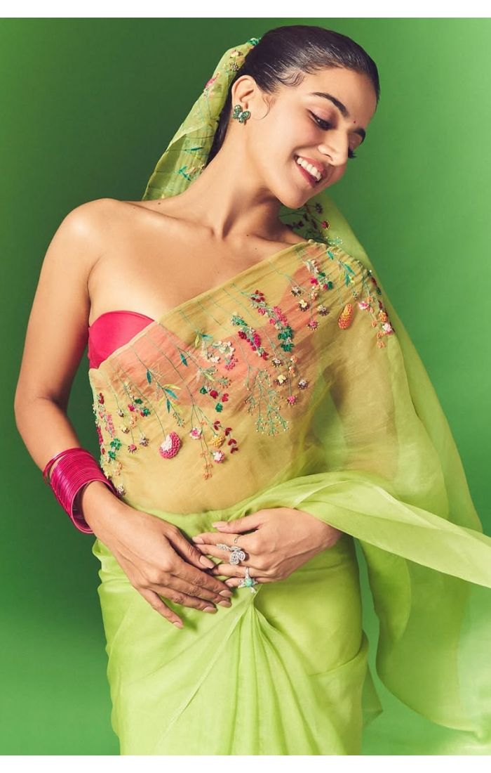  Front full view of model in pastel green designer saree perfect for Haldi or summer functions.