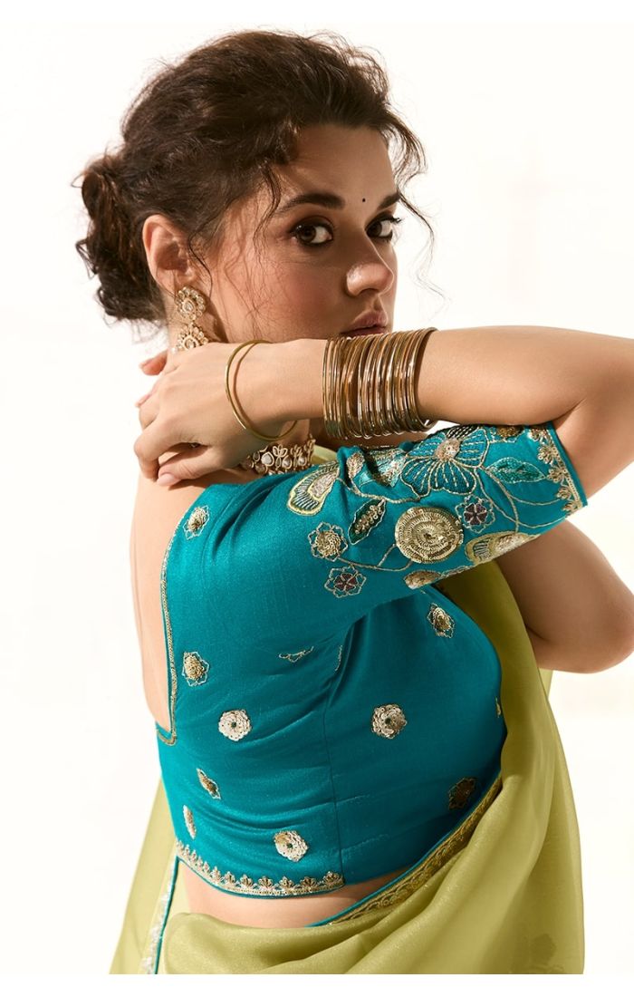 Back close-up of blue pure silk blouse with gold thread embroidery on sleeves