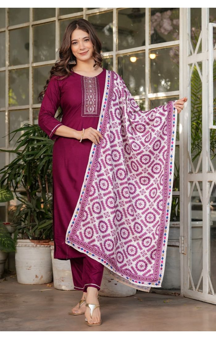 Maroon embroidered cotton kurta pant set with printed dupatta for festive and wedding occasions.