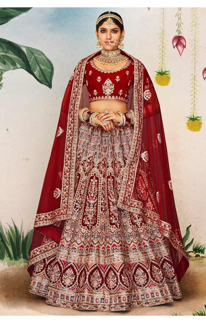 Full view of maroon velvet bridal lehenga with scoop neck blouse and intricate embroidery, royal wedding wear.