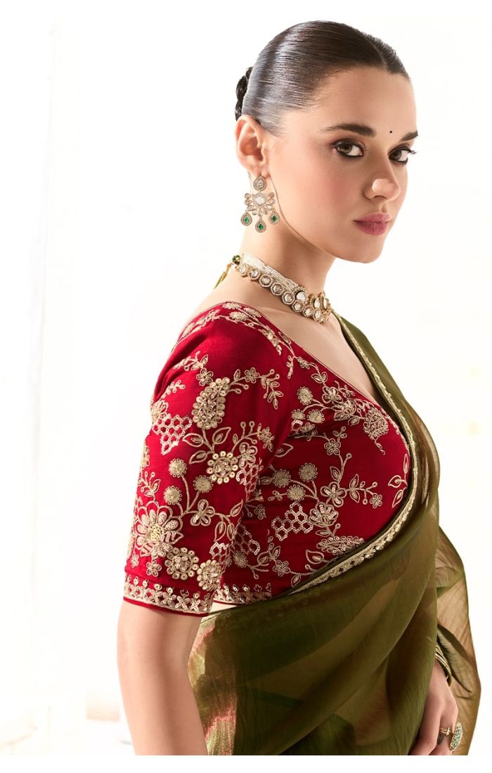 Close-up of red pure silk blouse with gold resham and zari floral embroidery.