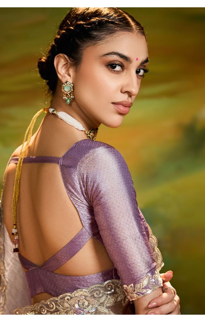  Side view of grey organza saree with intricate embroidery and lace border