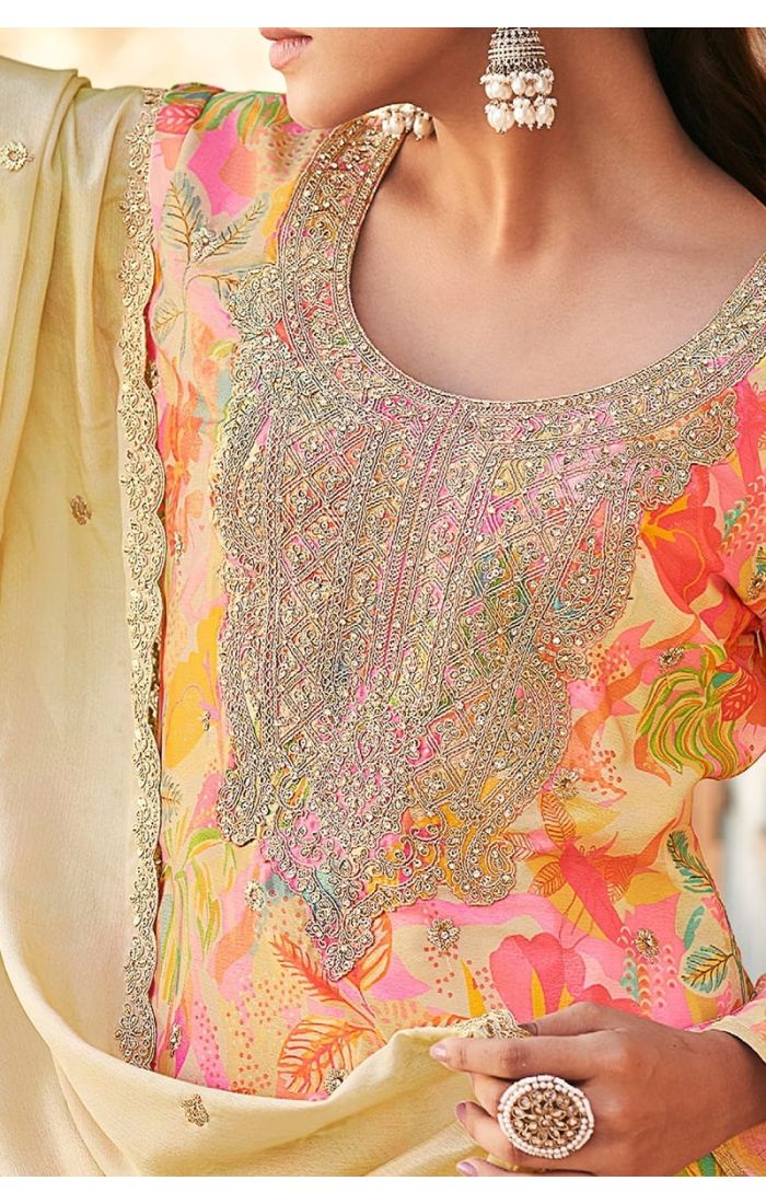 Close-up showcasing heavy thread embroidery, handwork, and vibrant digital print