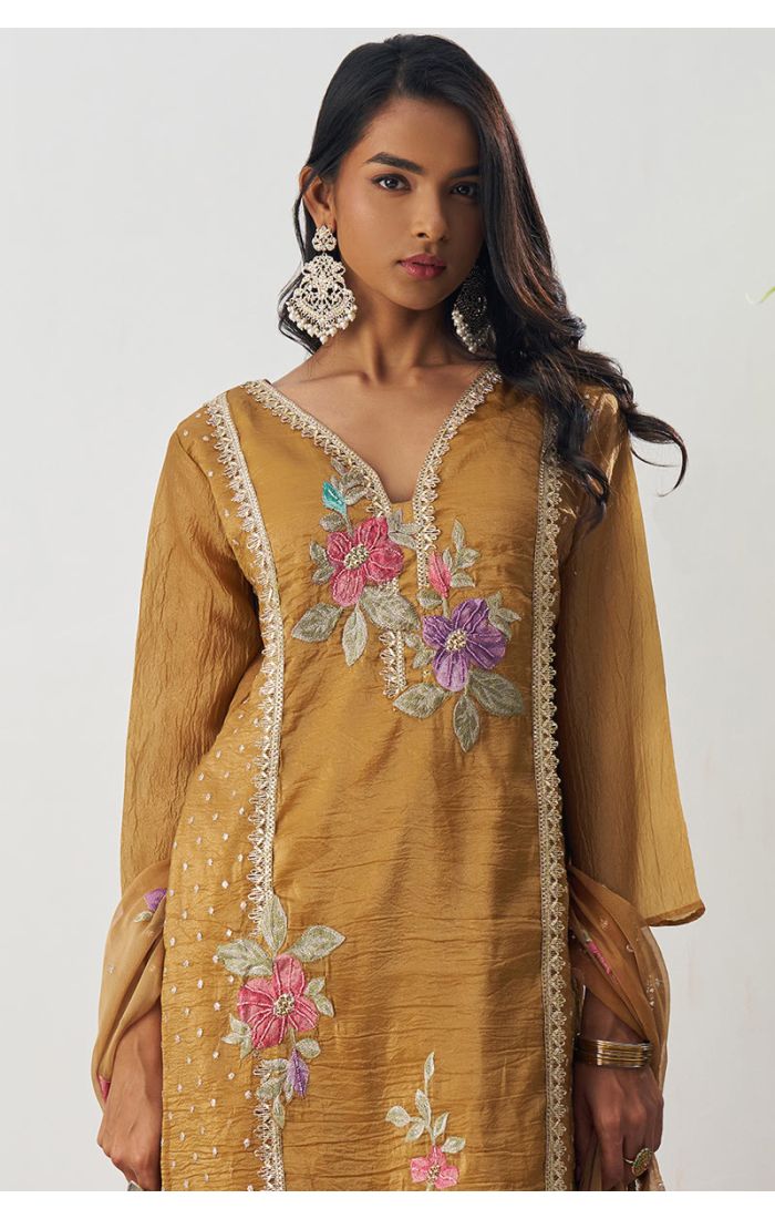 Pakistani style mustard crushed silk floral embroidered suit with V-neck, 3/4 sleeves, straight pants, and matching embroidered dupatta