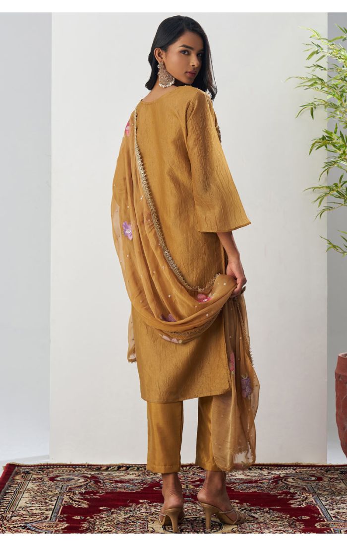 Pakistani style mustard crushed silk floral embroidered suit with V-neck, 3/4 sleeves, straight pants, and matching embroidered dupatta