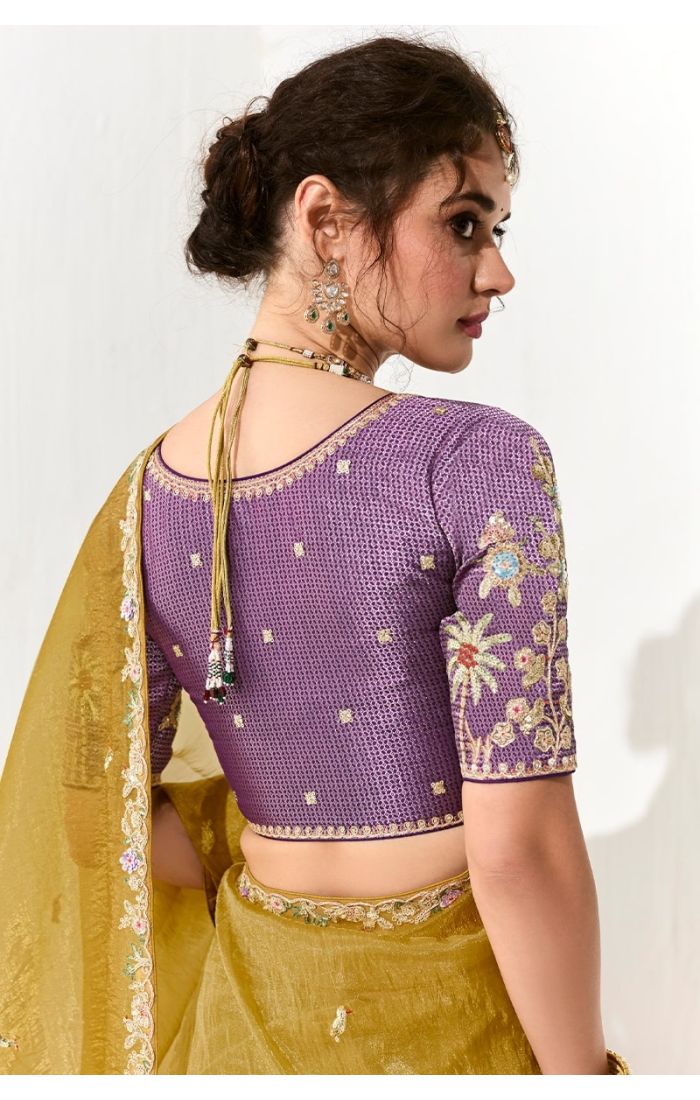 Back view of purple embroidered blouse paired with mustard saree