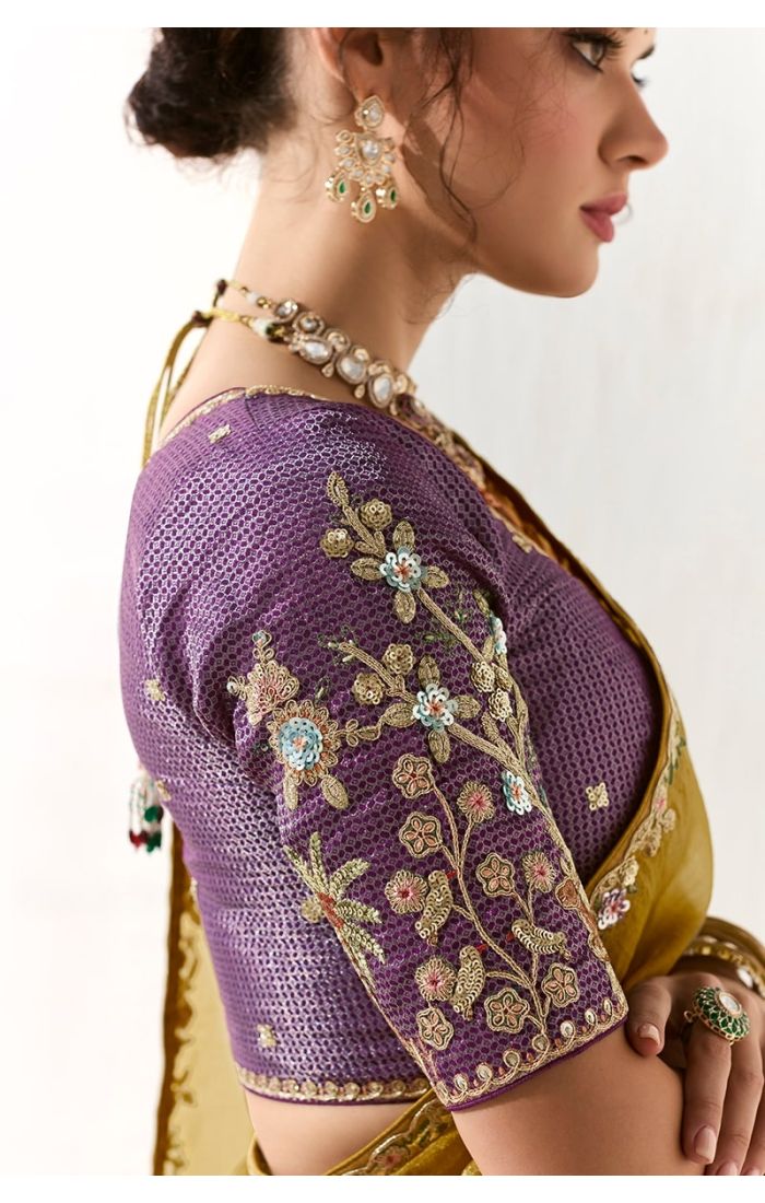 Close-up of purple silk blouse with floral embroidery detailing